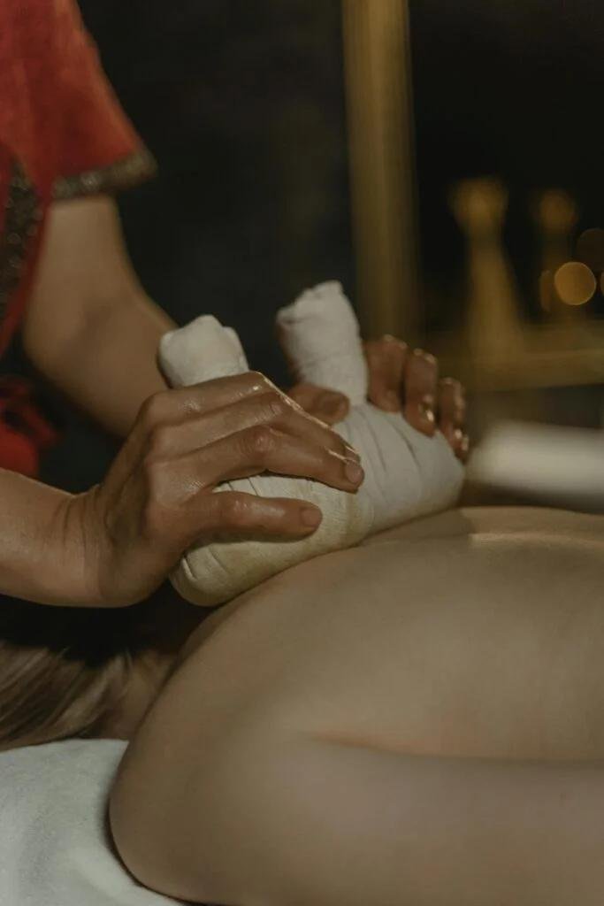 Traditional Thai herbal compress massage and wellness therapy