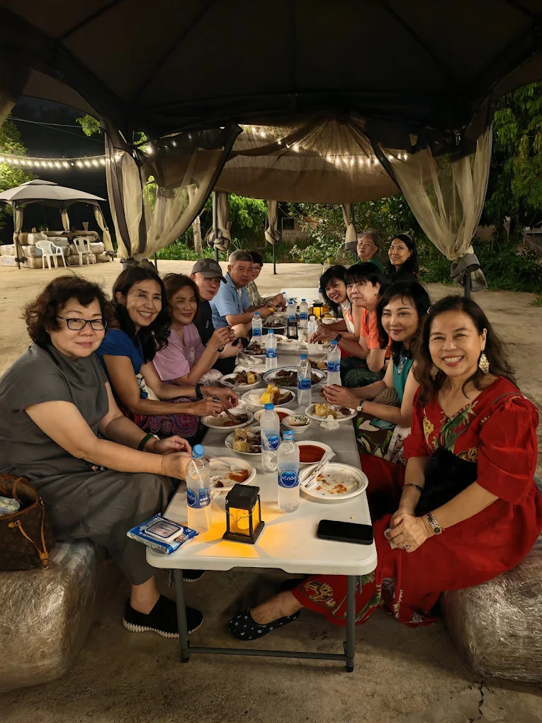 Guests sharing an outdoor meal at Firefly Pattaya