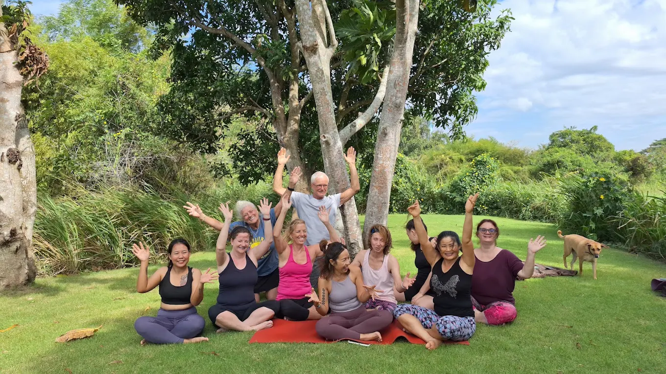 Guests enjoying a group wellness moment outdoors at Firefly Pattaya